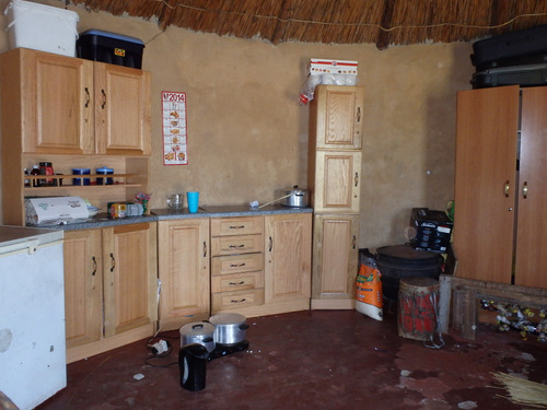 New cabinets, no running water, no stove but yes on hot plates.